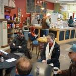 Rep. Sarah Vance, R-Homer, second from right, listens to a group of people before holding a town hall meeting on Monday, March 29, 2021, at Captains Coffee in Homer, Alaska. (Photo by Michael Armstrong/Homer News)