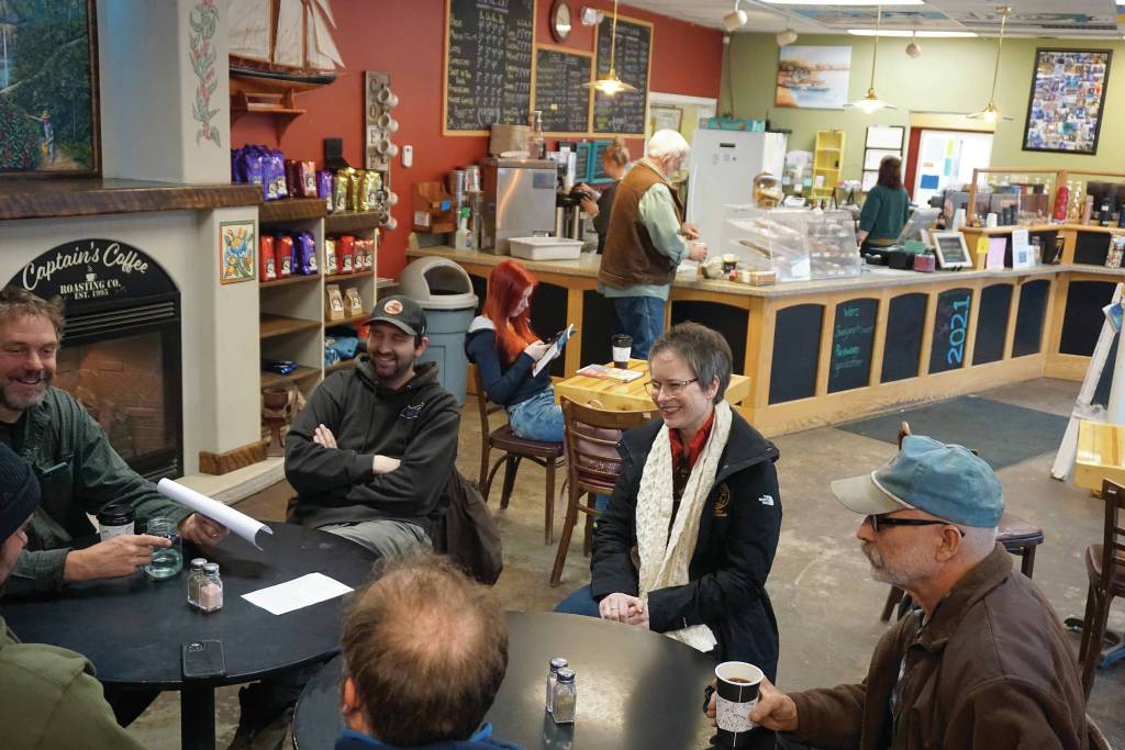 Rep. Sarah Vance, R-Homer, second from right, listens to a group of people before holding a town hall meeting on Monday, March 29, 2021, at Captains Coffee in Homer, Alaska. (Photo by Michael Armstrong/Homer News)