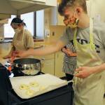Photo by Katelyn Engebretsen / Homer High Yearbook
Zoe Adkins and Emmet Wilkinson prepare pretzels in a high school food and nutrition class at Homer High School.