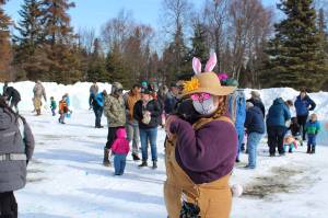 Kenai Parks and Recreation Laborer Charlotte Thurman dresses up as a rabbit at an Easter event at Kenai Municipal Park on Friday, April 2, 2021 in Kenai, Alaska. (Ashlyn OHara/Peninsula Clarion)