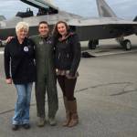 Mary Bondurant (left) and her assistant Erica Brincefield stand with an F22 pilot in front of the first F22 to land at Kenai Municipal Airport. (Photo courtesy Mary Bondurant)