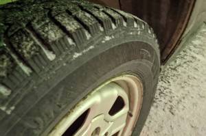 Snow falls on studded tires on Wednesday, April 7, 2021, in Kenai, Alaska. (Photo by Erin Thompson/Peninsula Clarion)