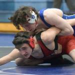 Soldotna's Ezekiel Miller controls Kenai Central's Owen Whicker at 130 pounds Friday, April 9, 2021, at Soldotna High School in Soldotna, Alaska. Miller won by major decision, 11-1. (Photo by Jeff Helminiak/Peninsula Clarion)