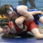 Soldotnas Ezekiel Miller controls Kenai Centrals Owen Whicker at 130 pounds Friday, April 9, 2021, at Soldotna High School in Soldotna, Alaska. Miller won by major decision, 11-1. (Photo by Jeff Helminiak/Peninsula Clarion)