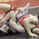 Caleb OHara works to a major decision of Kenai Centrals Talon Whicker at 125 pounds Tuesday, April 13, 2021, at Kenai Central High School in Kenai, Alaska. (Photo by Jeff Helminiak/Peninsula Clarion)