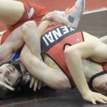 Caleb O'Hara works to a major decision of Kenai Central's Talon Whicker at 125 pounds Tuesday, April 13, 2021, at Kenai Central High School in Kenai, Alaska. (Photo by Jeff Helminiak/Peninsula Clarion)