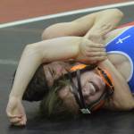 Kenai Centrals Owen Whicker works to a major decision of Justin Dickerson of Anchorage Christian Schools on Tuesday, April 13, 2021, at Kenai Central High School in Kenai, Alaska. (Photo by Jeff Helminiak/Peninsula Clarion)