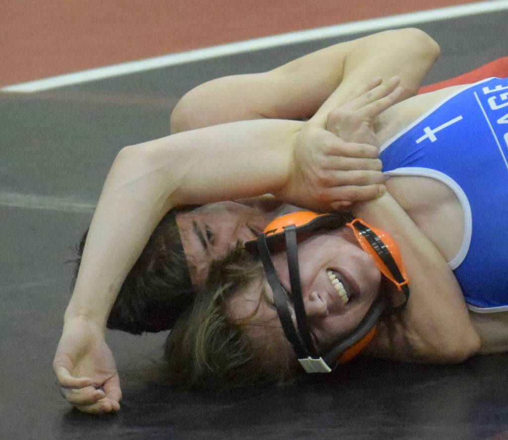 Kenai Centrals Owen Whicker works to a major decision of Justin Dickerson of Anchorage Christian Schools on Tuesday, April 13, 2021, at Kenai Central High School in Kenai, Alaska. (Photo by Jeff Helminiak/Peninsula Clarion)