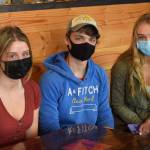 From left to right: Rhys Cannava, 16, Quinn Cox, 17, and Jolie Widaman, 16, are pictured here in Soldotna, Alaska on Thursday, April 15, 2021. The three Soldotna High School juniors got vaccinated against COVID-19 in March 2021. (Photo by Camille Botello/Peninsula Clarion)
