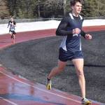 Soldotnas Nathanael Johnson leads Kenai Centrals Jack Laker on the way to victory in the 1,600-meter run in a dual meet Friday, April 16, 2021, at Kenai Central High School in Kenai, Alaska. (Photo by Jeff Helminiak/Peninsula Clarion)