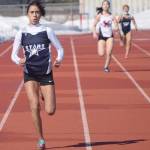Soldotnas Drysta Crosby-Schneider runs to victory in 400 meters in a dual meet with Kenai Central on Friday, April 16, 2021, at Kenai Central High School in Kenai, Alaska. (Photo by Jeff Helminiak/Peninsula Clarion)