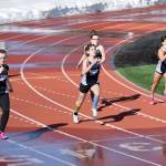 A heat of five runners competes in the 200-meter dash Friday in a dual meet between Kenai Central and Soldotna. Heats were limited to five runners due to the snow surrounding the track at Kenai Central High School in Kenai, Alaska. (Photo by Jeff Helminiak/Peninsula Clarion)