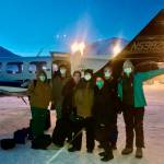 In this undated photo, provided by the Tanana Chiefs Conference, shows a team from the tribal health organization posing outside a plane before leaving for a rural vaccination clinic in Anaktuvuk Pass, Alaska. Some of Alaskas highest vaccination rates among those 16 or older have been in some of its remotest, hardest-to-access communities, where the toll of past flu or tuberculosis outbreaks hasnt been forgotten. (Tanana Chiefs Conference via AP)