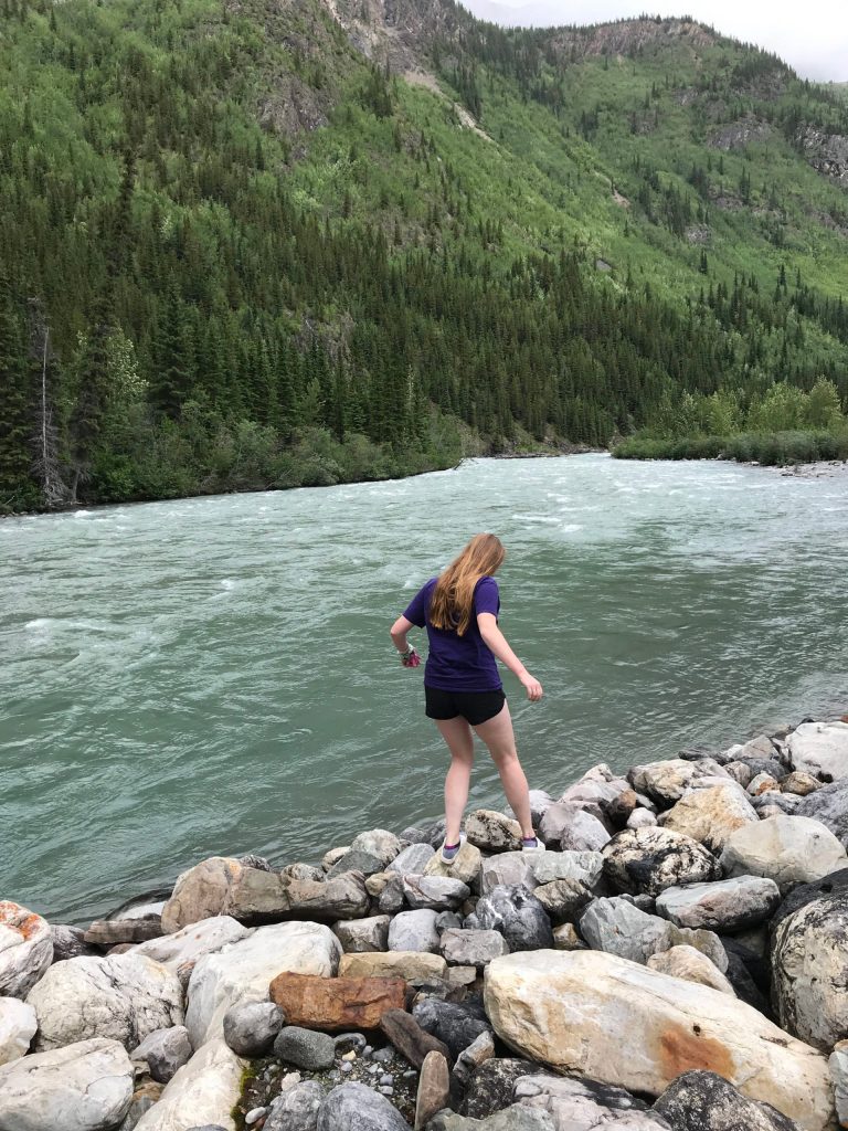 Camille Botello walks along a river in British Columbia while traveling up the Alaska Highway on July 16, 2020. (Photo provided)