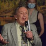 Caring for the Kenai Founder Merrill Sikorski presents Emily Moss with first place in the annual competition at Kenai Central High School on Wednesday, April 21, 2021. Her idea to place beehives in local landfills to divert birds in an effort to reduce the spread of avian-related pathogens sent her home with the grand prize of $1,600. (Photo by Camille Botello/Peninsula Clarion)