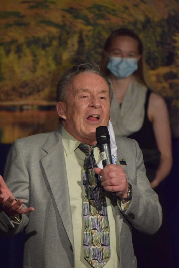 Caring for the Kenai Founder Merrill Sikorski presents Emily Moss with first place in the annual competition at Kenai Central High School on Wednesday, April 21, 2021. Her idea to place beehives in local landfills to divert birds in an effort to reduce the spread of avian-related pathogens sent her home with the grand prize of $1,600. (Photo by Camille Botello/Peninsula Clarion)