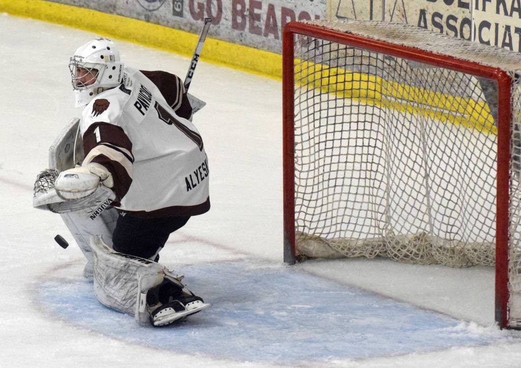 Kenai River Brown Bears goaltender Luke Pavicich turns aside a shot Friday, April 23, 2021, at the Soldotna Regional Sports Complex in Soldotna, Alaska. (Photo by Jeff Helminiak/Peninsula Clarion)