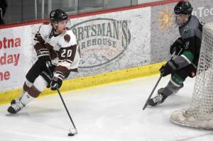 Kenai River Brown Bears forward Cam Blanton looks for an opening against Chippewa (Wisconsin) Steel defenseman Spencer Cox on Friday, April 23, 2021, at the Soldotna Regional Sports Complex. (Photo by Jeff Helminiak/Peninsula Clarion)
