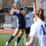 Soldotnas Jolie Widaman and Homers Kappa Reutov challenge for the ball Saturday, April 24, 2021, at Kenai Central High School in Kenai, Alaska. (Photo by Jeff Helminiak/Peninsula Clarion)