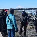 From left to right, counter-clock wise: Mia Werger, Teresa Becher, Deborah Boege Tobin, Madison Kosma, and Suzanne Steinert monitor beluga whales at the Kenai River on Saturday, April 24, 2021. (Photo by Camille Botello/Peninsula Clarion)