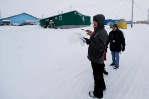 In this Jan. 20, 2020, file photo, census workers verify that their maps match up to the right amount of houses in Toksook Bay, Alaska, a mostly Yupik village on the edge of the Bering Sea. Alaskas population grew by 23,160 people, or 3.3%, in the last decade, according to the first numbers released Monday for the 2020 Census. (AP Photo/Gregory Bull, File)