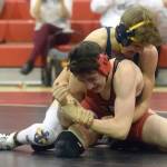Homers Austin Cline wrestles to a 20-13 decision over Kenai Centrals Talon Whicker at 135 pounds Tuesday, April 27, 2021, at Kenai Central High School in Kenai, Alaska. (Photo by Jeff Helminiak/Peninsula Clarion)