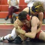 Homer's Austin Cline wrestles to a 20-13 decision over Kenai Central's Talon Whicker at 135 pounds Tuesday, April 27, 2021, at Kenai Central High School in Kenai, Alaska. (Photo by Jeff Helminiak/Peninsula Clarion)