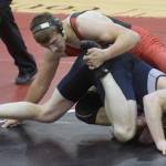 Kenai Centrals Tucker Vann wrestles to an exhibition victory over assistant coach Ben McPhail on Tuesday, April 27, 2021, at Kenai Central High School in Kenai, Alaska. (Photo by Jeff Helminiak/Peninsula Clarion)