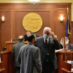 Sen. Bert Stedman, R-Sitka, speaks to Sen. Lyman Hoffman, D-Bethel, before a floor session to debate a bill over a disaster declaration in the state on Wednesday, April 28, 2021. The debate would take lawmakers into the evening Wednesday, as over 40 amendments were submitted on the bill. (Peter Segall / Juneau Empire)
