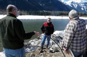 Alaska Gov. Mike Dunleavy, center, listens as residents discuss a levee they have concerns with on Thursday, April 22, 2021, in Hyder, Alaska. Hyder was among the southeast Alaska communities that Dunleavy visited as part of a one-day trip. (AP Photo/Becky Bohrer)
