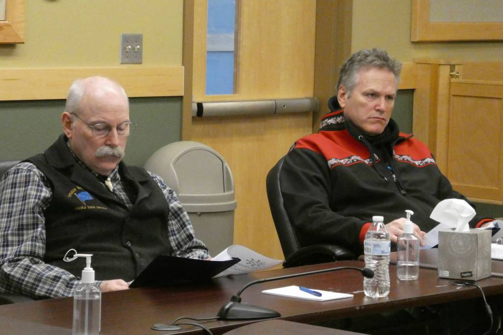 Alaska Gov. Mike Dunleavy, right, and state Sen. Bert Stedman are shown during a meeting with area leaders in Ketchikan, Alaska, on Thursday, April 22, 2021. Dunleavy visited Ketchikan as part of a one-day trip in southeast Alaska that included travel by small float plane to the communities of Hyder and Metlakatla. (AP Photo/Becky Bohrer)