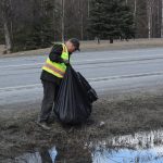 Friends of Alaska National Wildlife Refuge Volunteer Dan Musgrove collects litter from the side of the highway at the refuge in Soldotna, Alaska on Friday, April 30, 2021. (Camille Botello / Peninsula Clarion)