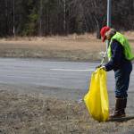 Friends of Alaska National Wildlife Refuge Vice President and Outreach Chair Poppy Benson collects litter from the side of the highway at the refuge in Soldotna, Alaska on Friday, April 30, 2021. (Camille Botello / Peninsula Clarion)