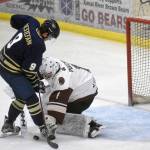 Kenai River Brown Bears goaltender Luke Pavicich stuffs Cade Destefani of the Janesville (Wisconsin) Jets on Friday, April 30, 2021, at the Soldotna Regional Sports Complex in Soldotna, Alaska. (Photo by Jeff Helminiak/Peninsula Clarion)