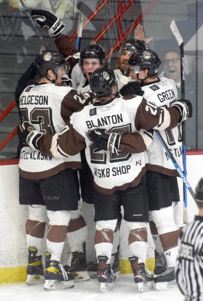 The Kenai River Brown Bears celebrate the first-period goal of Shayne Tomlinson (second from left) Friday, April 30, 2021 at the Soldotna Regional Sports Complex in Soldotna, Alaska. (Photo by Jeff Helminiak/Peninsula Clarion)