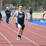 Soldotna Trenton OReagan (center) runs to victory in the 100 meters Saturday, May 1, 2021, at Soldotna High School in Soldotna, Alaska. (Photo by Jeff Helminiak/Peninsula Clarion)