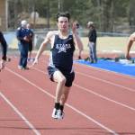 Soldotna Trenton O'Reagan (center) runs to victory in the 100 meters Saturday, May 1, 2021, at Soldotna High School in Soldotna, Alaska. (Photo by Jeff Helminiak/Peninsula Clarion)