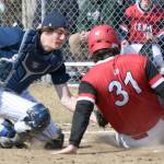 Kenai Central's Jackson DuPerron slides under the tag of Soldotna catcher Jacob Belger on Tuesday, May 4, 2021, at the Soldotna Little League fields in Soldotna, Alaska. (Photo by Jeff Helminiak/Peninsula Clarion)