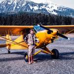 Biologist John Schoen with the Super Cub on a beach on Admiralty Island. The two antennas under each wing were used to determine which direction had the strongest signal from radio-collared animals. They then could locate the animals within an area about the size of an acre. (Photo by John Schoen)