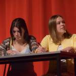 Shylea Freeman (left) and Camry Ellis act onstage as their characters Sharpay Evans and Gabriella Montez in the Nikiski Middle/High Schools spring production of High School Musical in Nikiski, Alaska, on Wednesday May 5, 2021. (Camille Botello / Peninsula Clarion)
