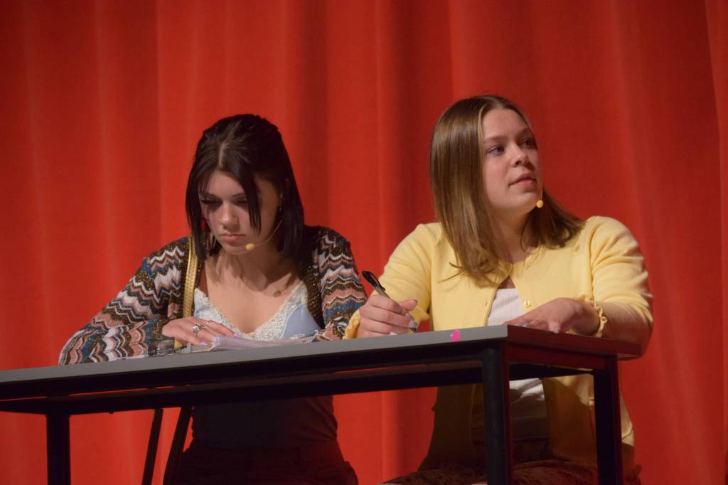 Shylea Freeman (left) and Camry Ellis act onstage as their characters Sharpay Evans and Gabriella Montez in the Nikiski Middle/High Schools spring production of High School Musical in Nikiski, Alaska, on Wednesday May 5, 2021. (Camille Botello / Peninsula Clarion)