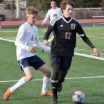 Kenai Centrals Samuel Baisden keeps the ball from Homers Austin Cline on Thursday, May 6, 2021, at Kenai Central High School in Kenai, Alaska. (Photo by Jeff Helminiak/Peninsula Clarion)