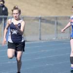 Soldotnas Gracie Bras sprints ahead of a Palmer runner during a preliminary heat of the girls 100 meters on the first day of the Palmer Invitational on Friday, May 7, 2021 at Palmer High School in Palmer, Alaska. (Photo by Jeremiah Bartz/Frontiersman)