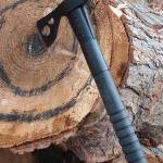 An ax is stuck in a log at Peninsula Axe Throwing in Cooper Landing in this undated photo. (Peninsula Axe Throwing website)