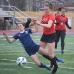 Soldotnas Bay Bloom and Kenai Centrals Bethany Morris collide while chasing the ball Tuesday, May 11, 2021, at Soldotna High School in Soldotna, Alaska. (Photo by Jeff Helminiak/Peninsula Clarion)