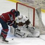 Laker Aldridge of the Fairbanks Ice Dogs tries to solve Kenai River Brown Bears goalie Luke Pavicich on Friday, May 14, 2021, at the Soldotna Regional Sports Complex in Soldotna, Alaska. (Photo by Jeff Helminiak/Peninsula Clarion)