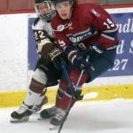 Kenai River Brown Bears forward Peter Morgan and Fairbanks Ice Dogs forward Ty Naaykens battle for the puck Friday, May 14, 2021, at the Soldotna Regional Sports Complex in Soldotna, Alaska. (Photo by Jeff Helminiak/Peninsula Clarion)