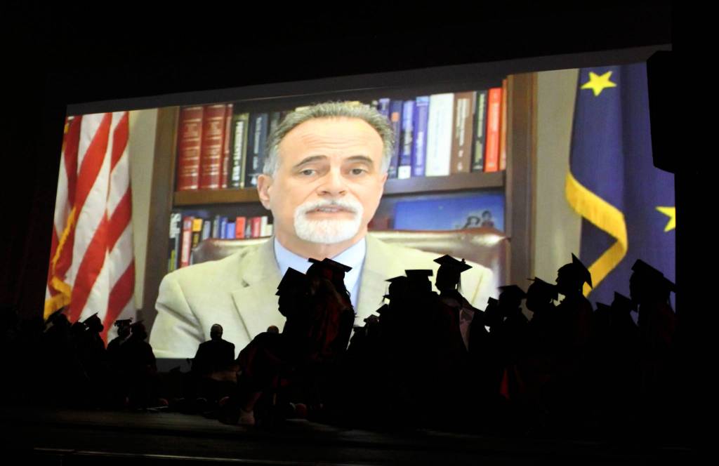 State Sen. Peter Micciche remotely addresses graduates at Kenai Central High School on Monday, May 17, 2021 in Kenai, Alaska. (Ashlyn OHara/Peninsula Clarion)