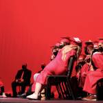 Students play a game of telephone during graduation at Kenai Central High School on Monday, May 17 in Kenai, Alaska. (Ashlyn OHara/Peninsula Clarion)