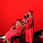 Graduates hold roses during Kenai Central High Schools 2021 graduation ceremony on Monday, May 17, 2021 in Kenai, Alaska. (Ashlyn OHara/Peninsula Clarion)